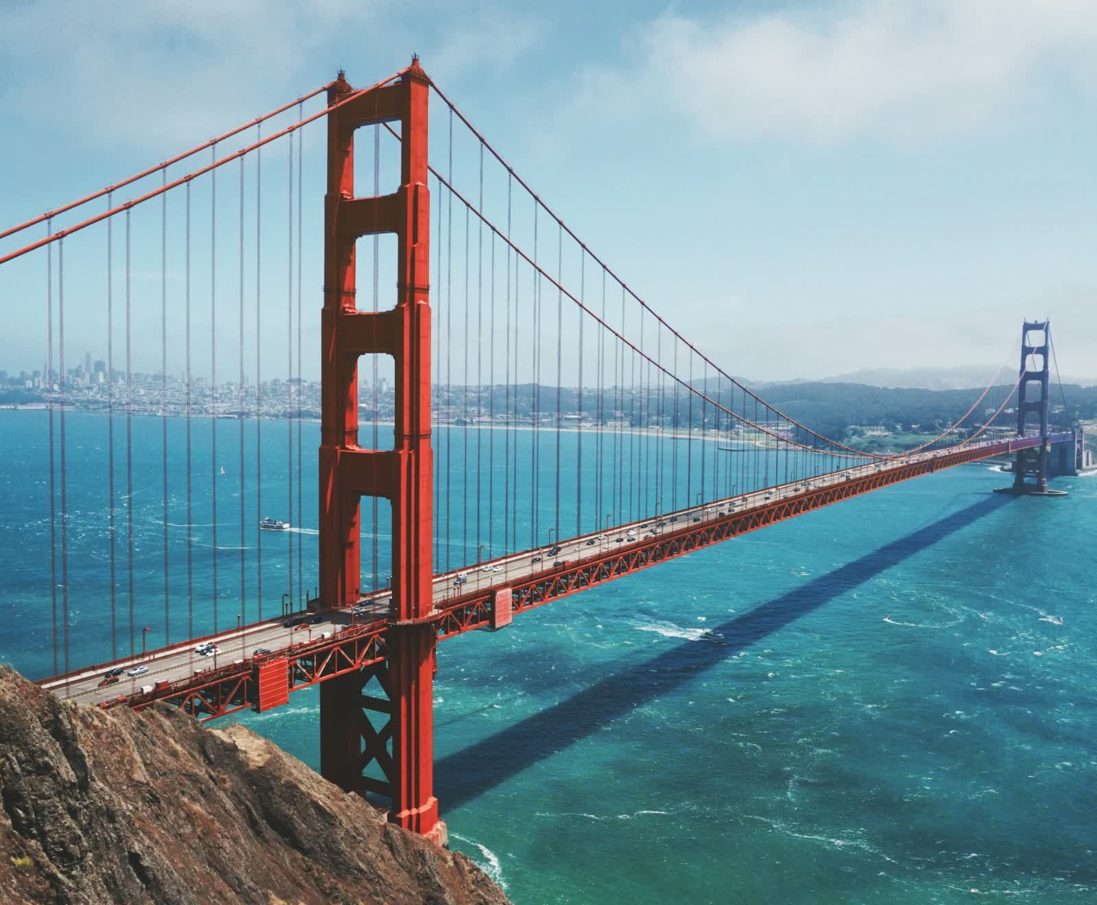 The Golden Gate Bridge with the San Francisco skyline behind it