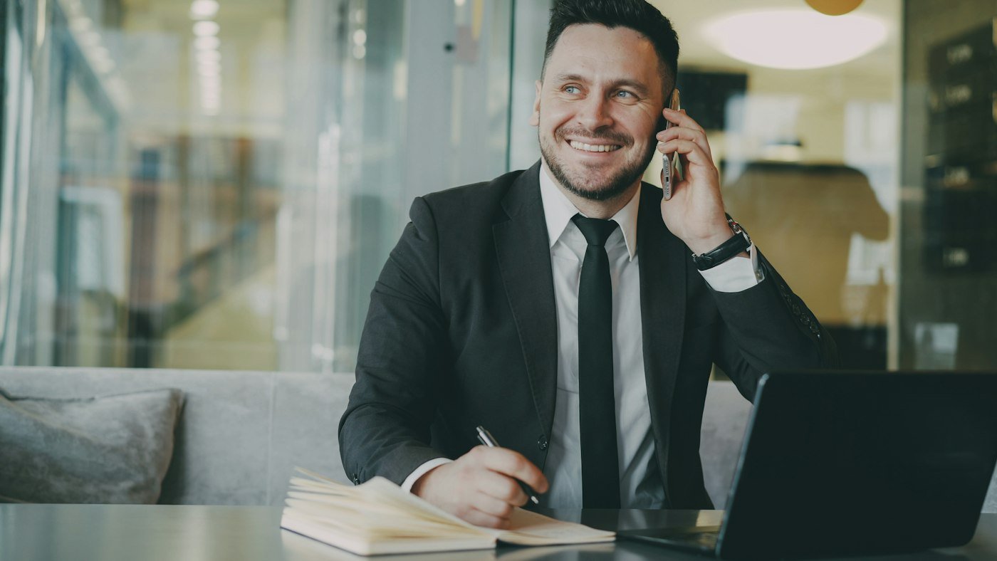 Professional on a phone call at an office desk