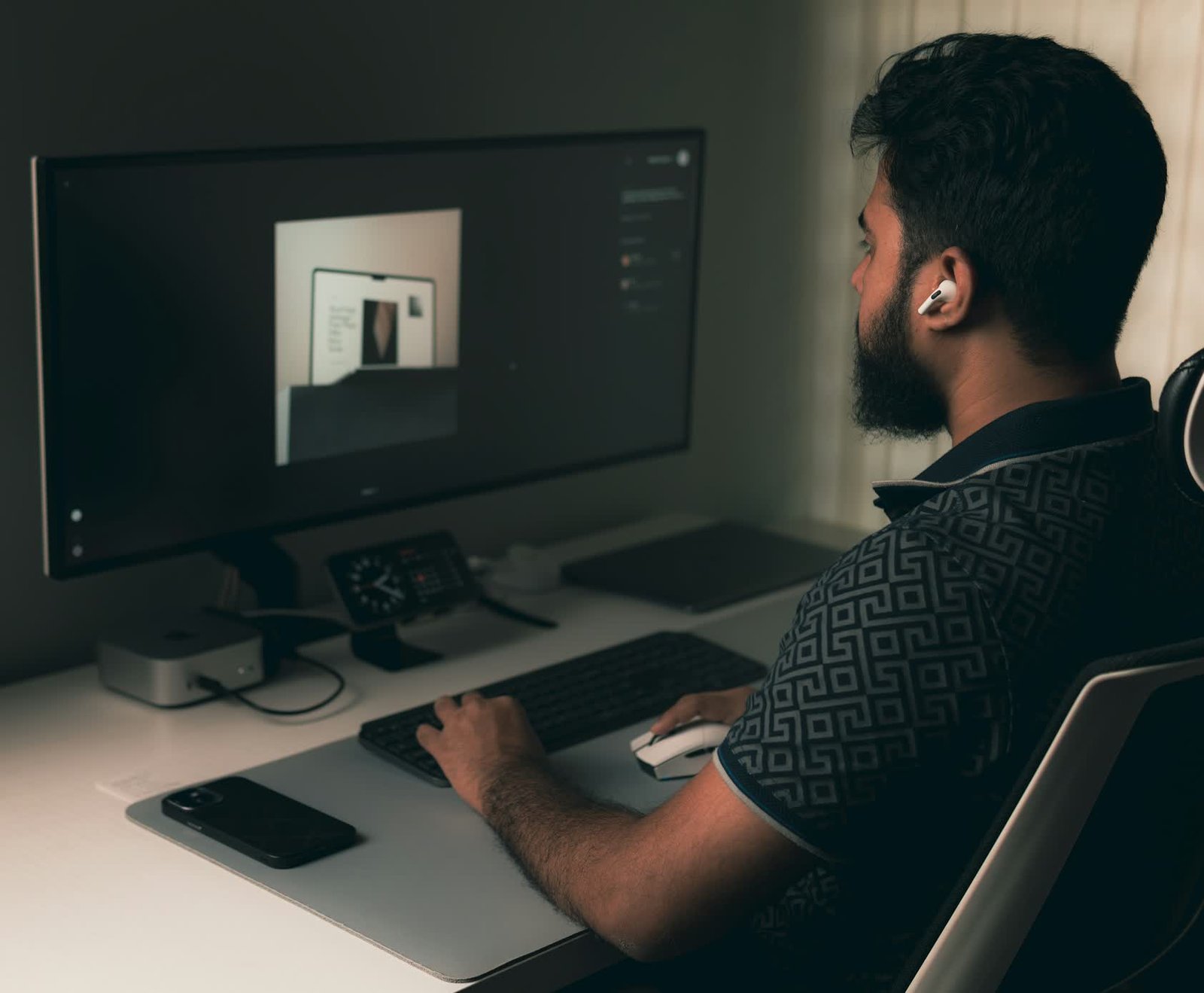A designer building a law firm website on a wide monitor